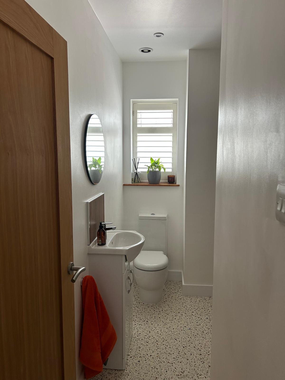 Fully renovated bathroom with new suite and terrazzo-style flooring
