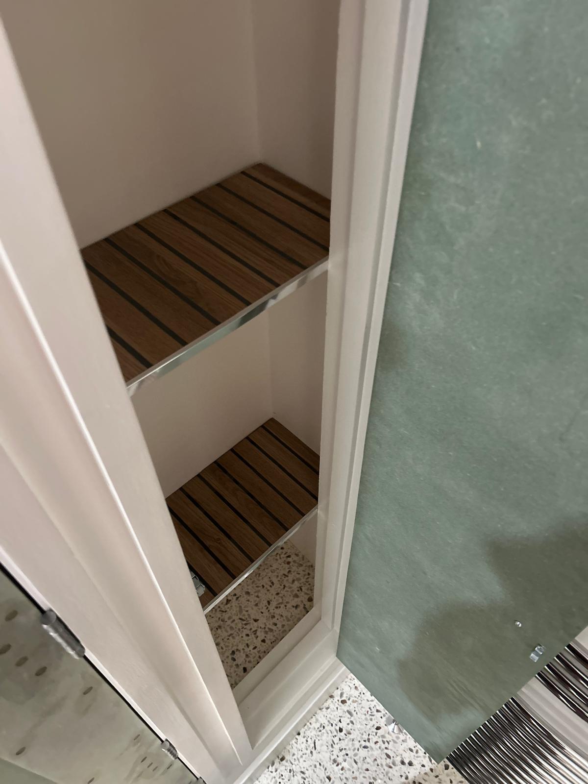 Bespoke boiler cupboard with fitted internal shelving