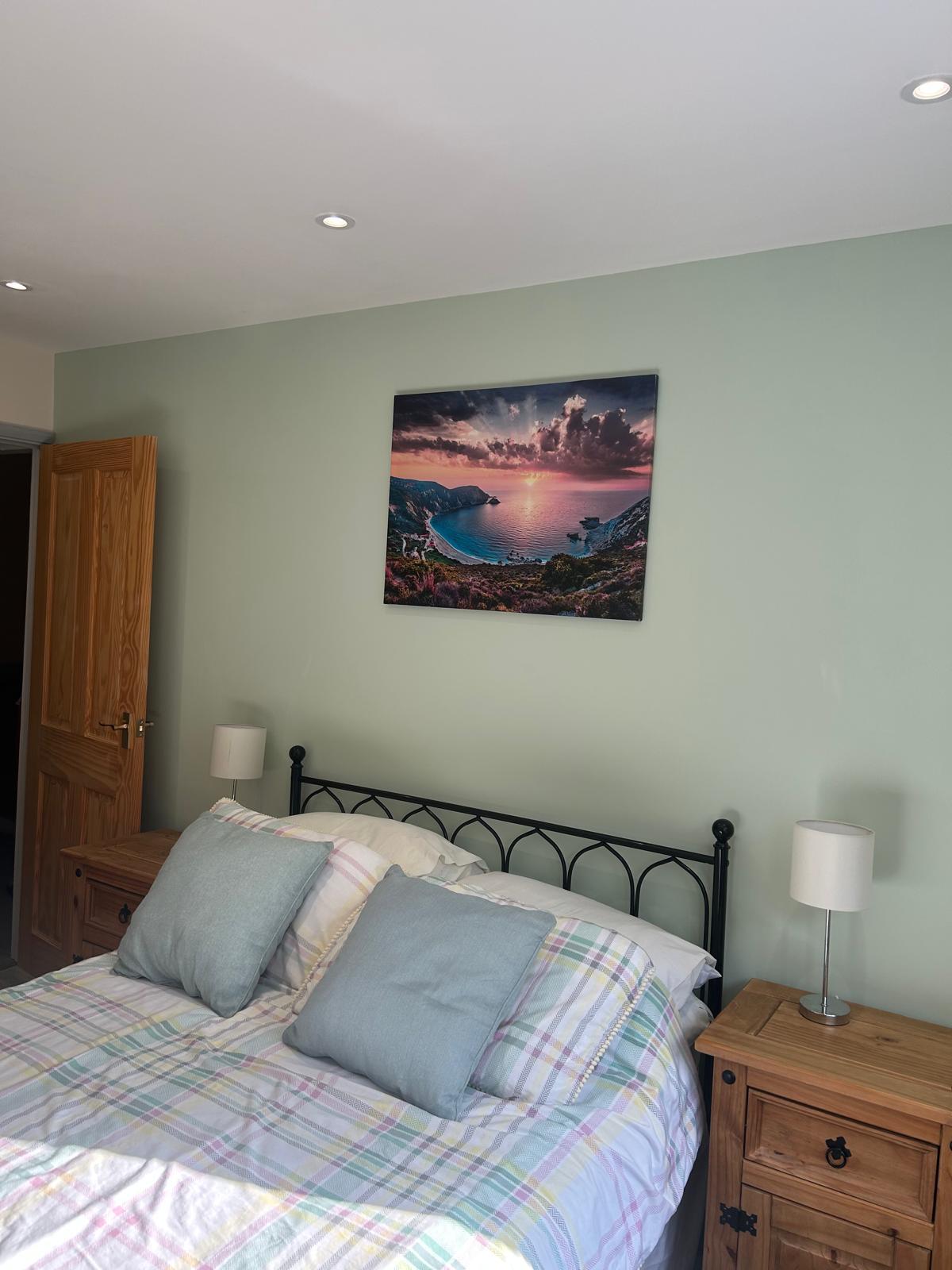 Finished bedroom with new bed area, wall canvas and crisp paintwork