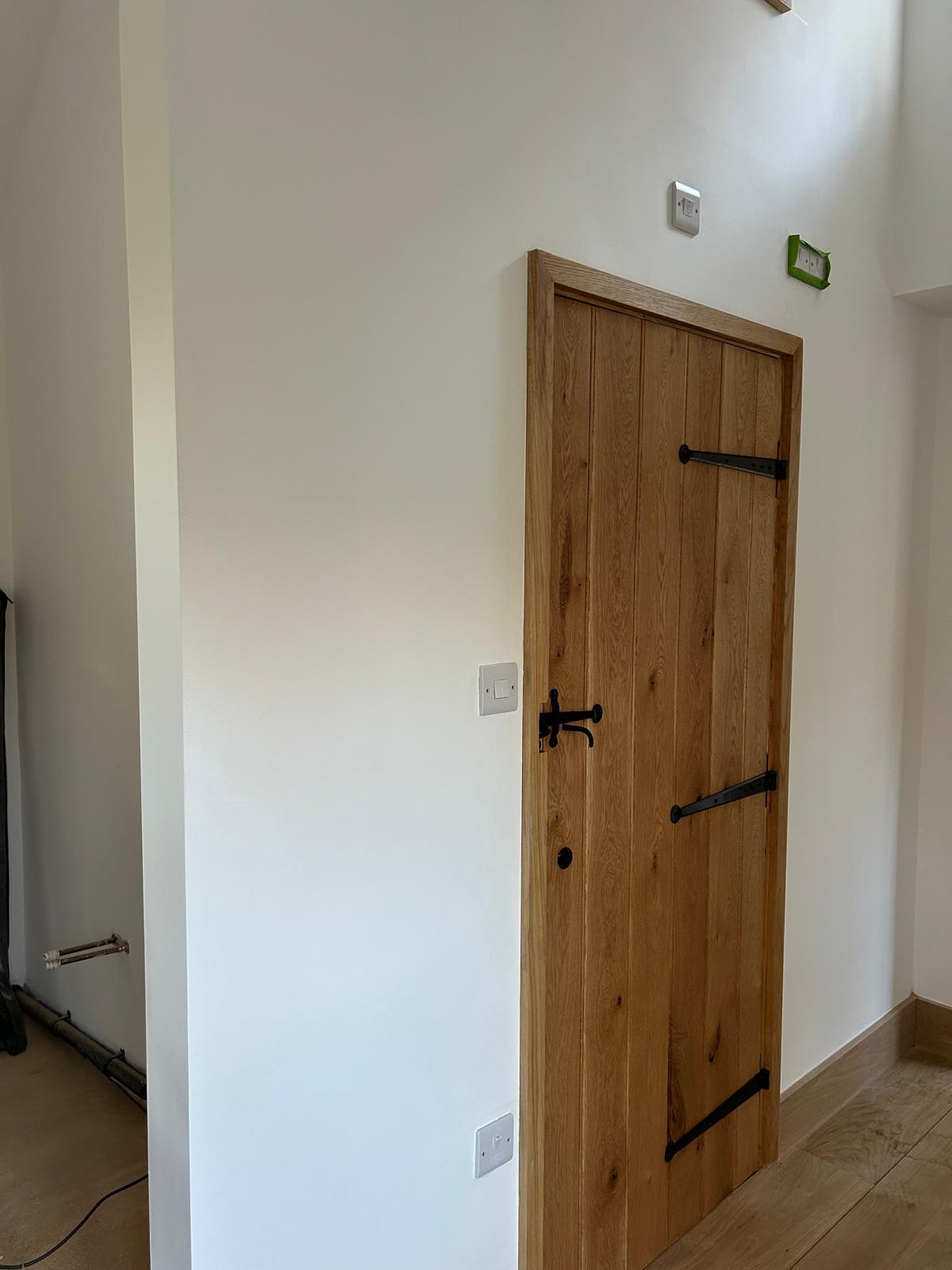 Timber door hung with premium ironmongery by MRN Building and Carpentry