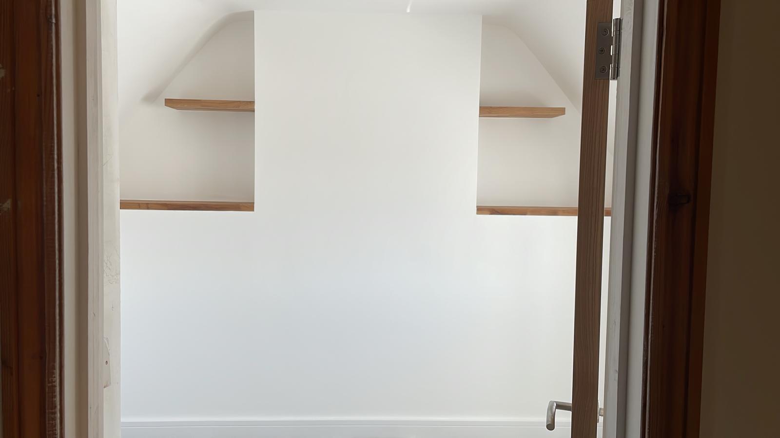Floating shelves fitted in a loft room by MRN Building and Carpentry