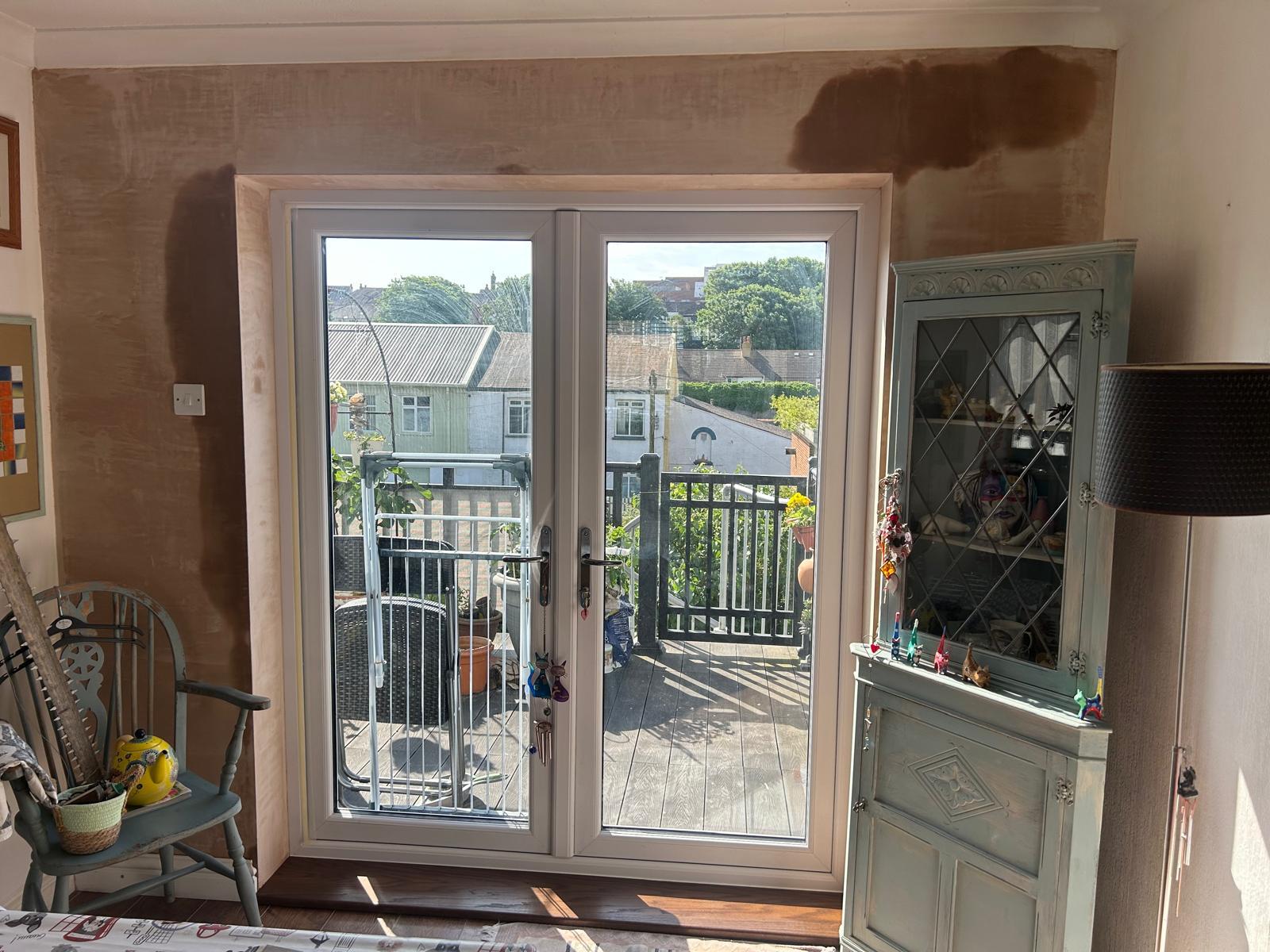 New French doors with fresh plastering