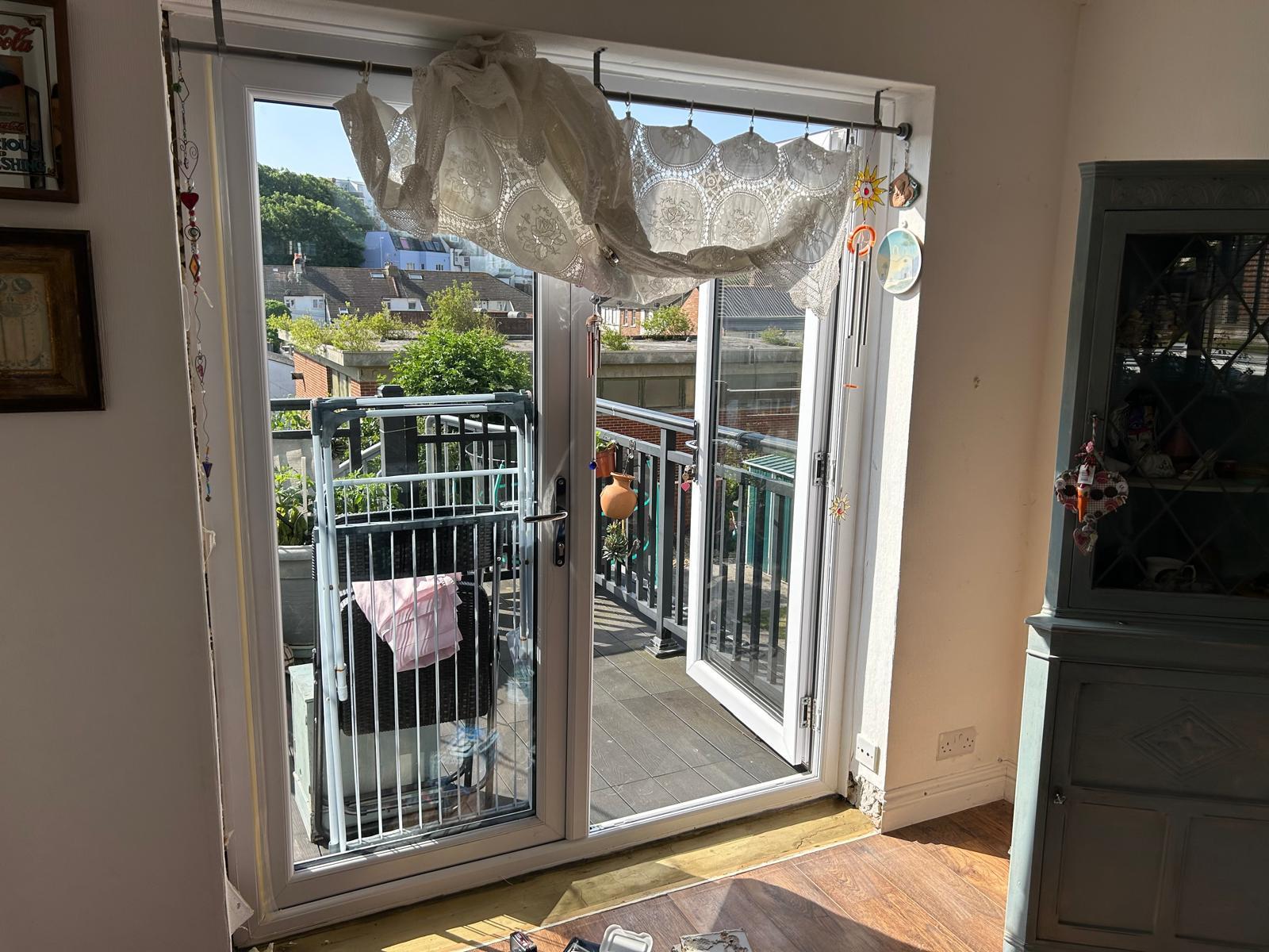 French doors opening onto the balcony during interior refurbishment