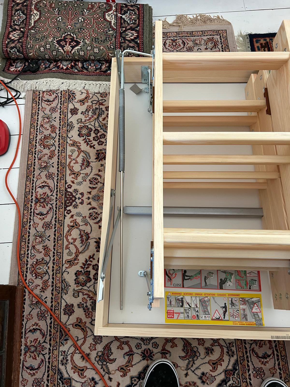 Folding loft ladder mechanism during installation