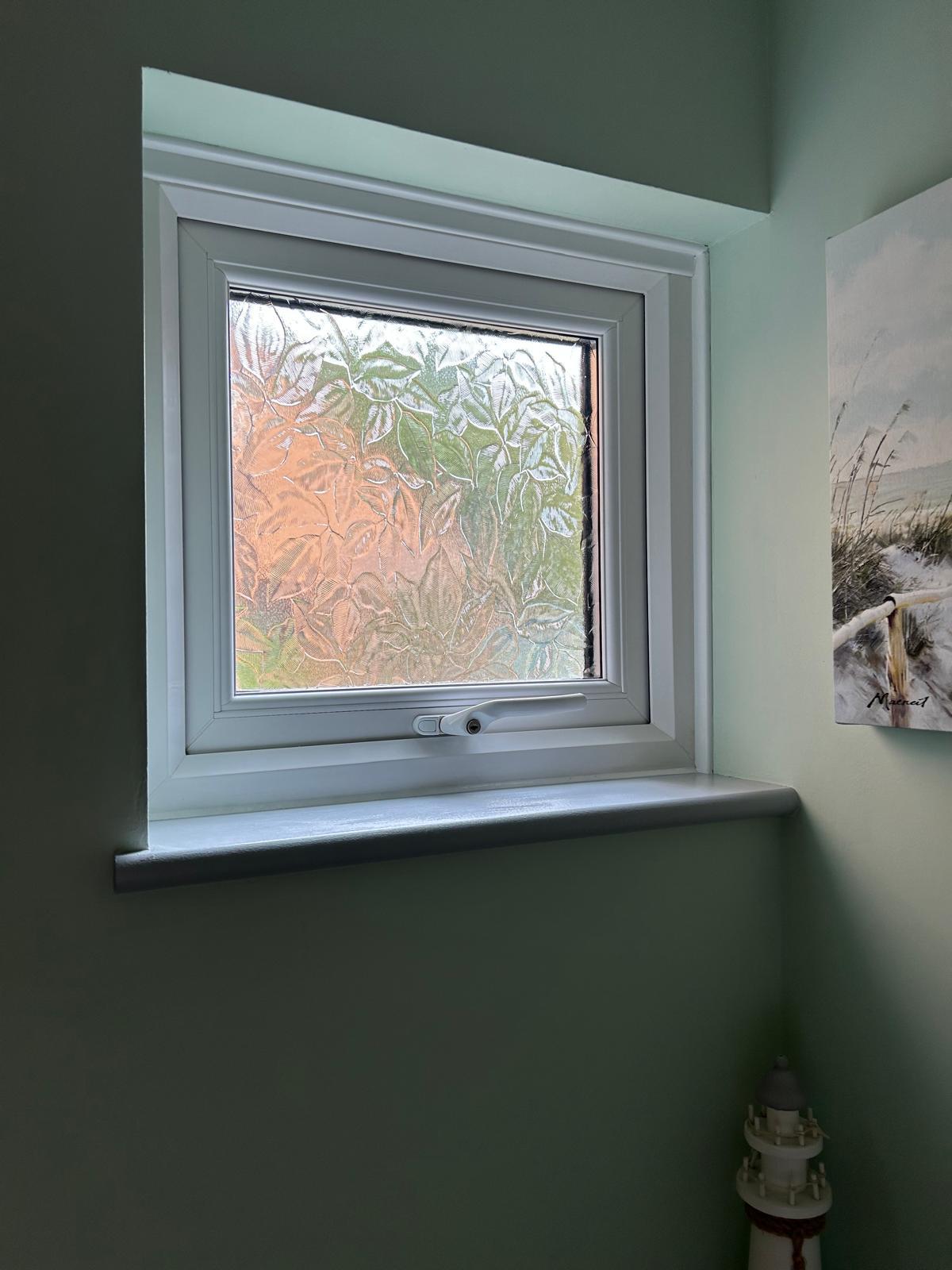 Frosted window detail in the converted understairs toilet